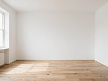Eye-level architectural photography of a bright, minimalist apartment interior, soft natural daylight, white walls, light oak flooring, 35mm lens.