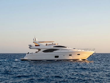 A luxury white yacht sailing on the clear blue waters of the Red Sea in Egypt, sunny day.
