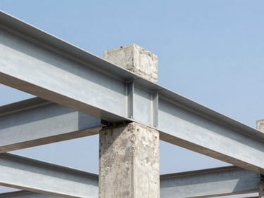 Bright architectural photography, close-up of structural steel beams and reinforced concrete joints on a real Colombian construction site in Bogotá, crisp midday sunlight, sharp focus, 35mm