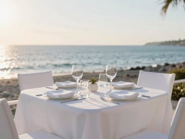 An impeccably set outdoor dining table overlooking the Gulf at sunset, soft coastal sun.