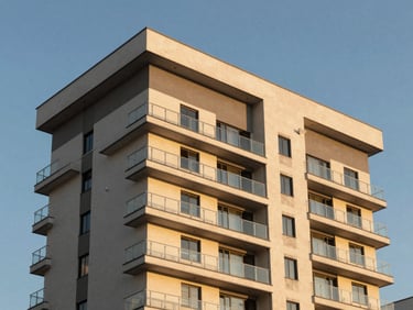 Modern residential building facade in Suzano under golden hour light, clean architectural lines, blue sky background