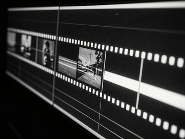 Abstract image of film editing timeline on a screen, sharp cuts, high-contrast monochrome, neon glow from the screen, cinematic.