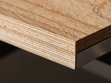 Macro shot of premium calibrated plywood edge, showing clean, perfectly pressed structural layers under dramatic side-lighting.