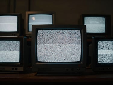 Cinematic film still, dark room illuminated only by old CRT monitors showing static noise, high contrast, moody atmosphere