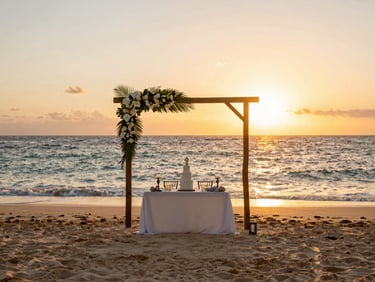 Elegant beach wedding setup at sunset in Punta Cana, warm natural light, soft ocean waves in background