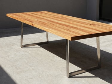 Architectural furniture photography, direct sunlight with sharp structural shadows, a long teak and zinc-primed steel dining table on a raw concrete patio, warm cedar tones, 35mm