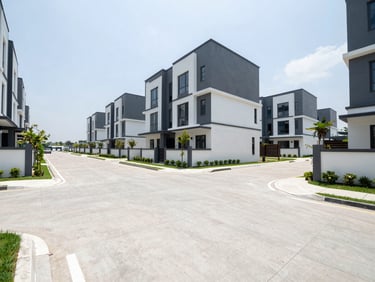 Wide-angle exterior shot of a luxury housing development with clean concrete roads, Serpong.