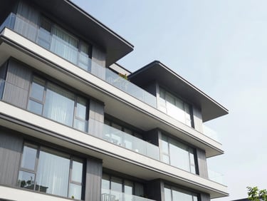 Crisp architectural photography of a modern villa facade with glass walls, bright natural daylight, Cibubur.