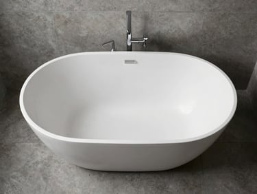 Overhead shot of a sleek, modern freestanding bathtub in a minimalist bathroom, surrounded by polished concrete-look tiles. Soft, diffused natural light highlights the clean lines and reflective surface of the tub. Symmetrical composition.