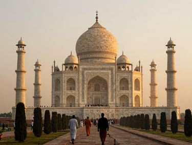 Elevated view of the Taj Mahal at sunrise from the western garden path, a few pilgrims silhouetted in the foreground, pale amber light on the marble dome