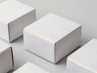 Luxury custom-printed cardboard boxes with gold foil details, clean minimalist composition