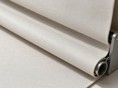 Close-up of a high-end roller blind fabric being treated with fine mist, bright daylight, clean textures