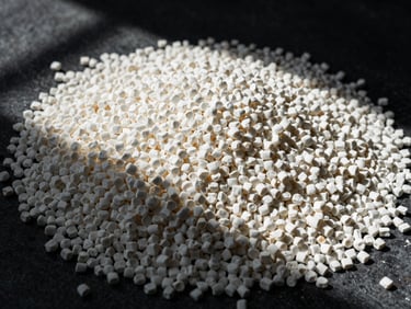Macro photography of raw white polymer pellets in harsh natural sunlight, high contrast, industrial texture, 35mm