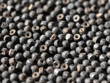 Extreme macro shot of raw industrial polymer pellets, high contrast, sharp daylight, steel tones, 35mm.