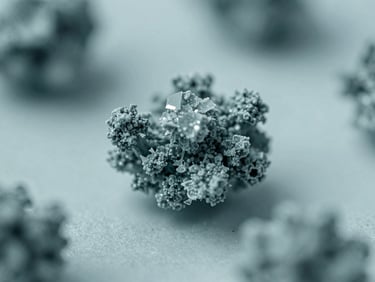 Macro photography of crystalline small-molecule compounds under cool diffused laboratory lighting, sterile teal tones, high-contrast details