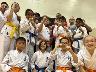 a group of people standing around a group of kids