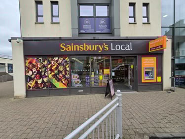 a store front of a store with a sign that says sainsburys local Kempock Street in Gourock