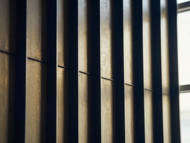 Abstract geometric pattern symbolizing structure and security, deep navy and brass tones, high-contrast shadows, 35mm