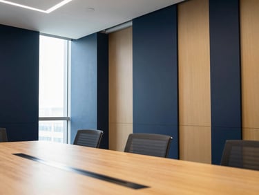 Architectural crop of a modern corporate boardroom with clean lines and deep navy accents.