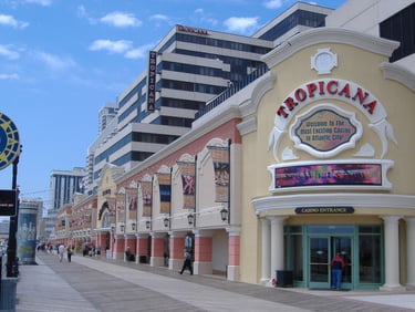 a city street scene with a clock tower in the background