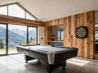Bright modern recreation room in Bronte Haus with a high-quality billiard table, dart board on the wall, warm wood accents, clean architectural lines, natural alpine light