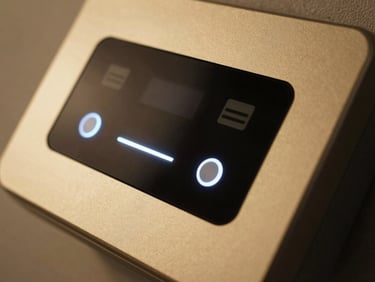 Close-up of a sleek, modern access control panel with glowing indicators, metallic gold tones, studio lighting.