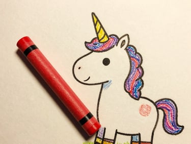 Close-up of a whimsical hand-drawn unicorn with a distinct, charmingly bent horn, holding a giant red crayon, warm textured paper background