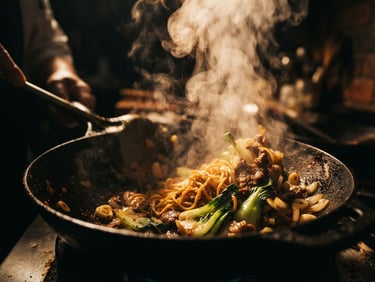Moody close-up of steam rising from a wood-fired wok, dramatic low-key side lighting, rich warm amber tones, macro lens, shallow depth of field