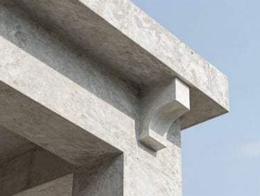 Close-up of a perfectly finished plaster molding meeting a raw concrete structural beam, sharp natural daylight, 35mm architectural photography