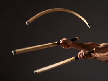 Dramatic athletic photography, motion-blurred arcs of nunchaku, close-up of hands in action, dark charcoal background, warm gold highlights