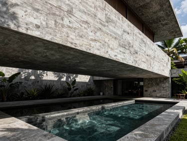 One-point perspective of a tropical brutalist villa in Bali, massive concrete cantilever over a dark stone pool, framed by sharp shadows.