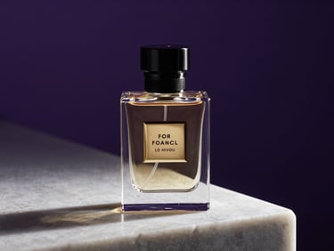 Close-up of a luxury fragrance bottle on a polished obsidian surface, single key light raking from the left casting a hard shadow, deep purple background, studio-controlled, advertising composition