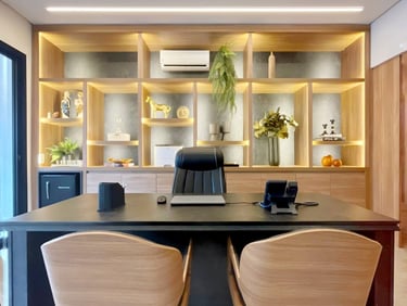 a desk with a laptop and a laptop on it