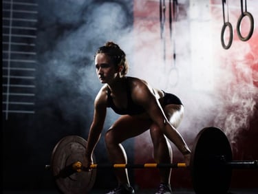 a girl lifting weight bar at gym