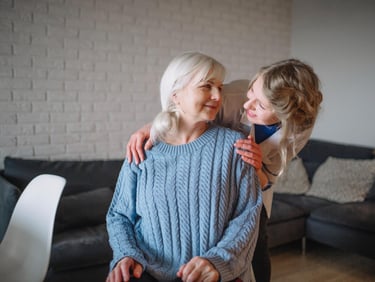 A compassionate home care worker discussing with an elderly woman.