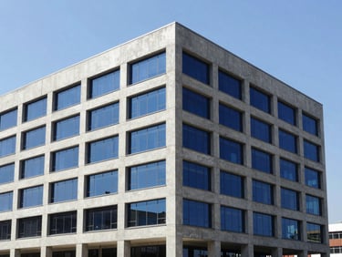 Crisp corporate photography of a newly completed modern concrete building in Dschang, bright daylight, sharp focus, architectural lines, deep blue and warm accents, editorial, 35mm