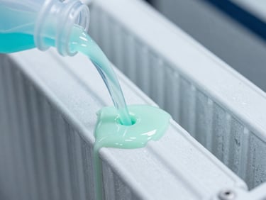 Pouring neon-colored coolant additive into a clean radiator tank, high contrast, macro photography showing fluid mixing.