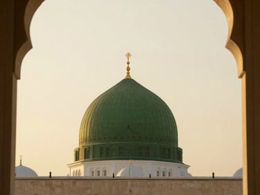 The green dome of Al-Masjid an-Nabawi in Madinah under a soft golden sky, quiet morning light, elegant architectural framing