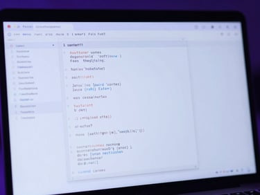Close-up of a laptop screen displaying clean code and digital design wireframes, illuminated by soft violet and electric blue ambient light, shallow depth of field, 35mm lens