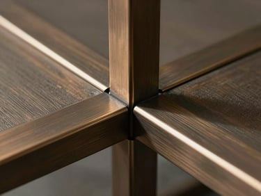 Close-up of bespoke architectural metalwork, razor-thin steel joints, brushed bronze finish, dramatic directional light