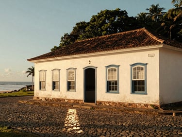 Wide environmental shot of a traditional colonial shopfront in São Francisco do Sul, warm golden hour sunlight reflecting on cobblestones, 35mm photography