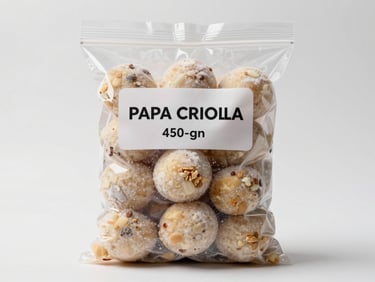 Straight-on product shot of a sealed 450-gram bag of frozen papa criolla on a clean white surface, clinical studio lighting, label area neutral, frost visible on the bag