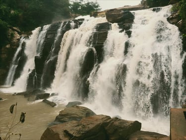 A majestc view of jonha falls (also known as Gautamdhara Falls), a scenic 43 meter waterfall surrounded by greenery in Ranchi