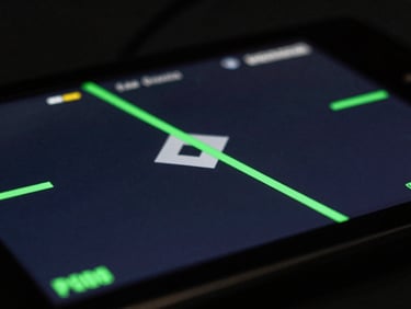 Close-up of a mobile gaming screen rendering rapid 3D geometry, sharp focus, low-key lighting with terminal green key lights