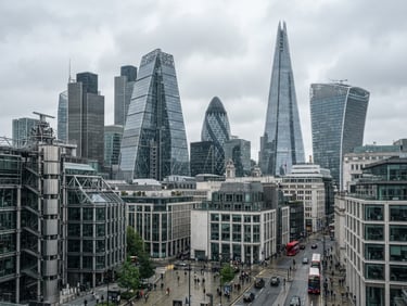 Wide environmental shot of modern steel and glass financial architecture in London under diffused overcast daylight, sharp focus, 35mm