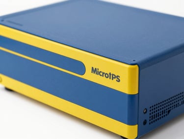 Clean close-up of a compact Microtek UPS system, bright commercial photography, clean natural daylight, sharp focus, high-contrast blue and yellow tones, 35mm lens