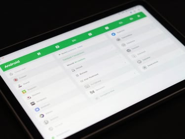 Macro shot of a physical Android tablet showing a complex multi-column dashboard layout, crisp display, studio lighting.