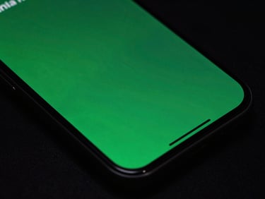Close-up of a modern Android phone displaying a fluid, high-framerate user interface transition with rich green accents, dark background.