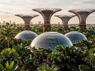 Modern glass domes of Gardens by the Bay surrounded by lush tropical greenery, soft morning light, 35mm
