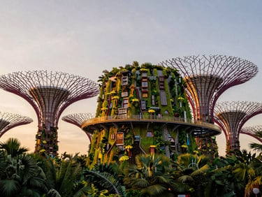 Futuristic vertical gardens of Gardens by the Bay under a soft tropical twilight sky, architectural detail